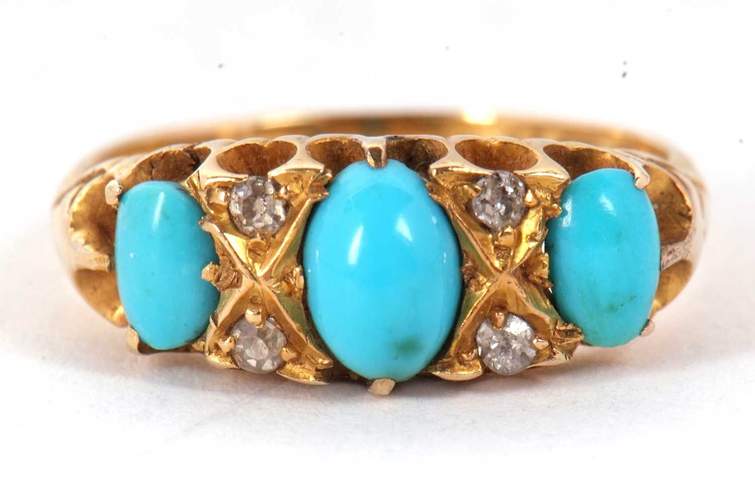 A late Victorian 18ct turquoise and diamond ring, the three slightly graduated oval turquoise