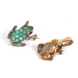 A frog brooch, set with round turquoise cabochons and red eyes, all set in unmarked white metal (