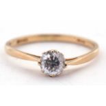 A 14ct CZ ring, the round white CZ claw mounted to a plain band stamped 585 with London assay