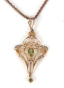 An Edwardian peridot and seed pearl pendant, the central oval peridot in millegrain collet mount,