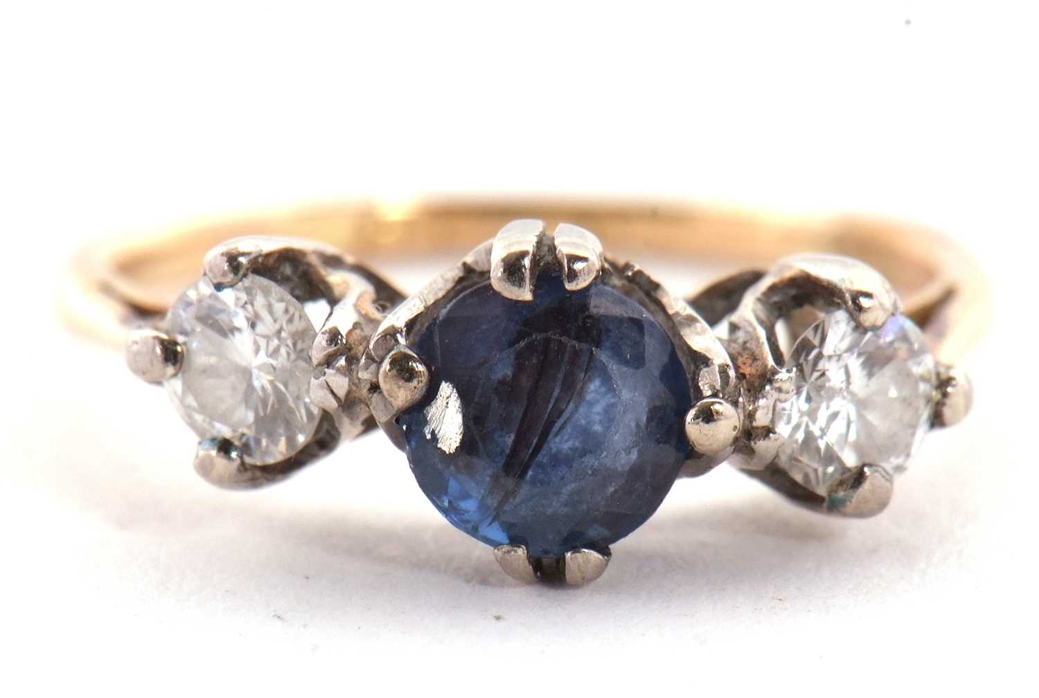 A sapphire and diamond ring, the round mixed cut sapphire set to either side with a round - Image 2 of 7