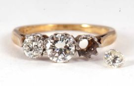 A three stone diamond ring, the three graduated round brilliant cut diamonds (one loose), total
