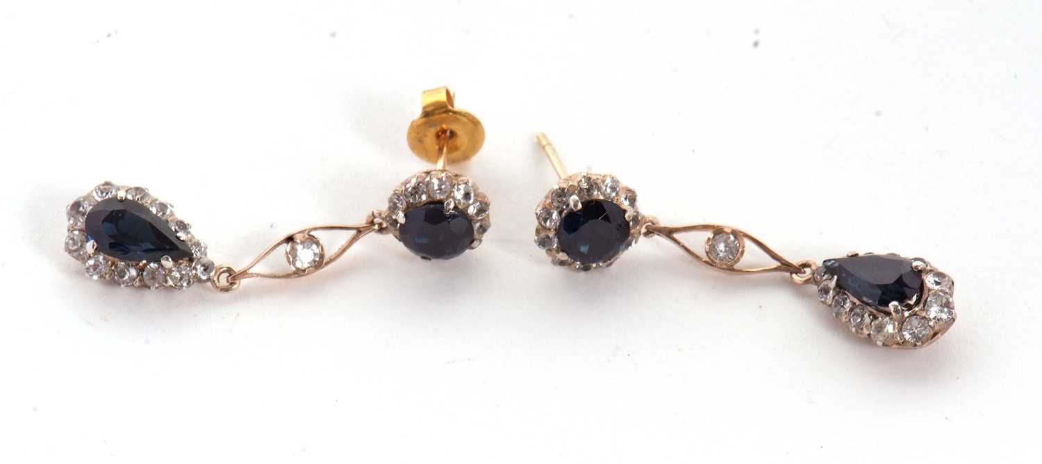 A pair of sapphire and white stone earrings, the round blue sapphire surrounded by small white - Image 3 of 5