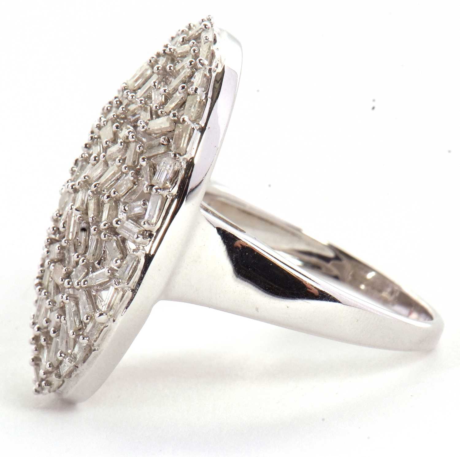 A diamond plaque ring, the oval plaque set with a mix of tapered baguette cut diamonds, totalling - Image 4 of 7