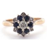 A 9ct sapphire and diamond cluster ring, the central round brilliant cut diamond surrounded by small