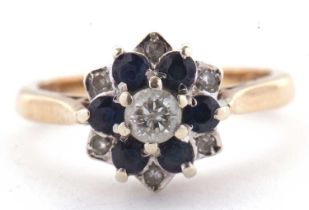 A 9ct sapphire and diamond cluster ring, the central round brilliant cut diamond surrounded by small