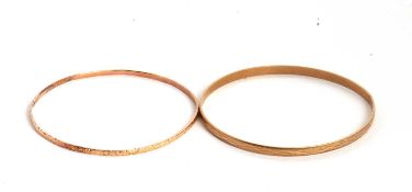 A 9ct bangle and another, the 9ct bangle, 4mm wide with textured finish, hallmarked London 1991, 6.