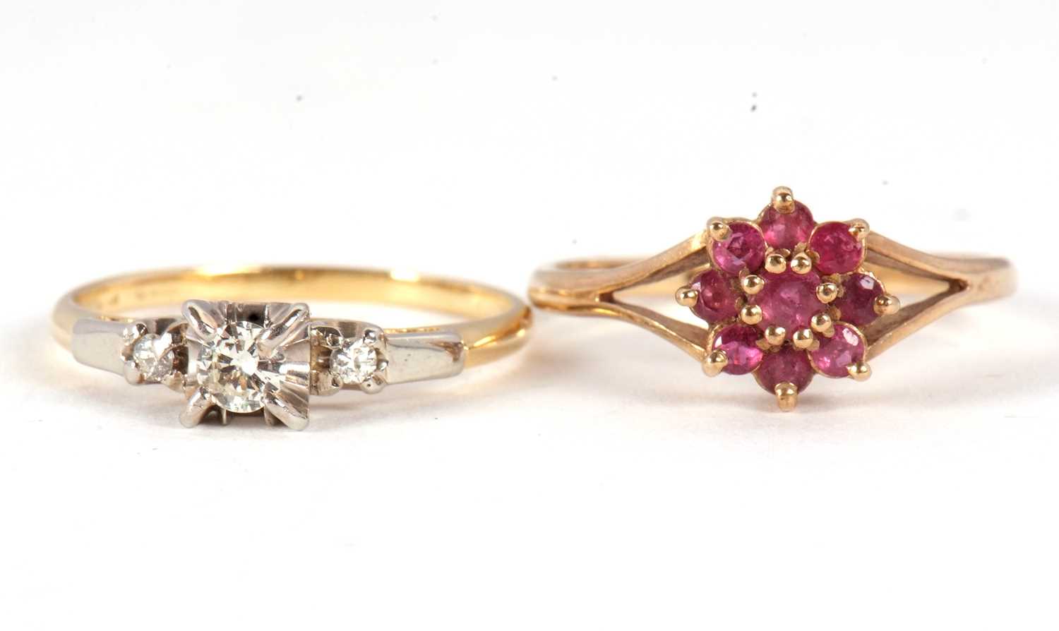 Two gemset rings, the first a three stone diamond ring in white metal mounts to a plain band of