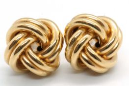 A pair of 18ct knot style earrings, approx. 13mm diameter, with posts stamped 750 and hallmarked