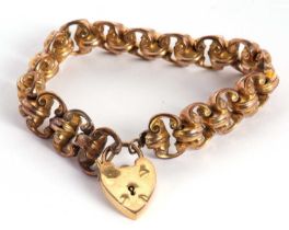 A 19th century fancy link bracelet, the hollow fancy links in unmarked yellow metal, with later