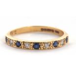An 18ct sapphire and diamond ring, the half hoop ring set with alternating round sapphires and