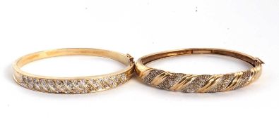 A 9ct and diamond hinged bangle, the 8mm wide bangle with diagonal set strips of small round