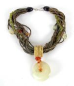 A mixed hardstone necklace, with round jade disc pendant, 55mm diameter, set with carnelian chips,