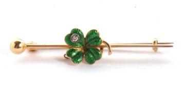 An enamelled four leaf clover bar brooch, the green enamelled four leaf clover, set with a white