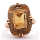 A 9ct citrine ring, the oval mixed cut citrine, approx. 19mm long, in four double claw mount with