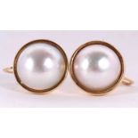 A pair of cultured mabe pearl earrings, the round cultured mabe pearls in rubover mounts, approx.