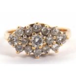 An 18k diamond ring, the navette shaped cluster ring set with small round diamonds, total