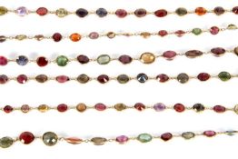 A multi gemset necklace, the spectacle set oval stones to include garnets, spinels, corundums,