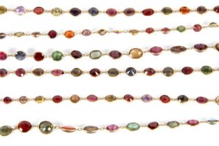 A multi gemset necklace, the spectacle set oval stones to include garnets, spinels, corundums,