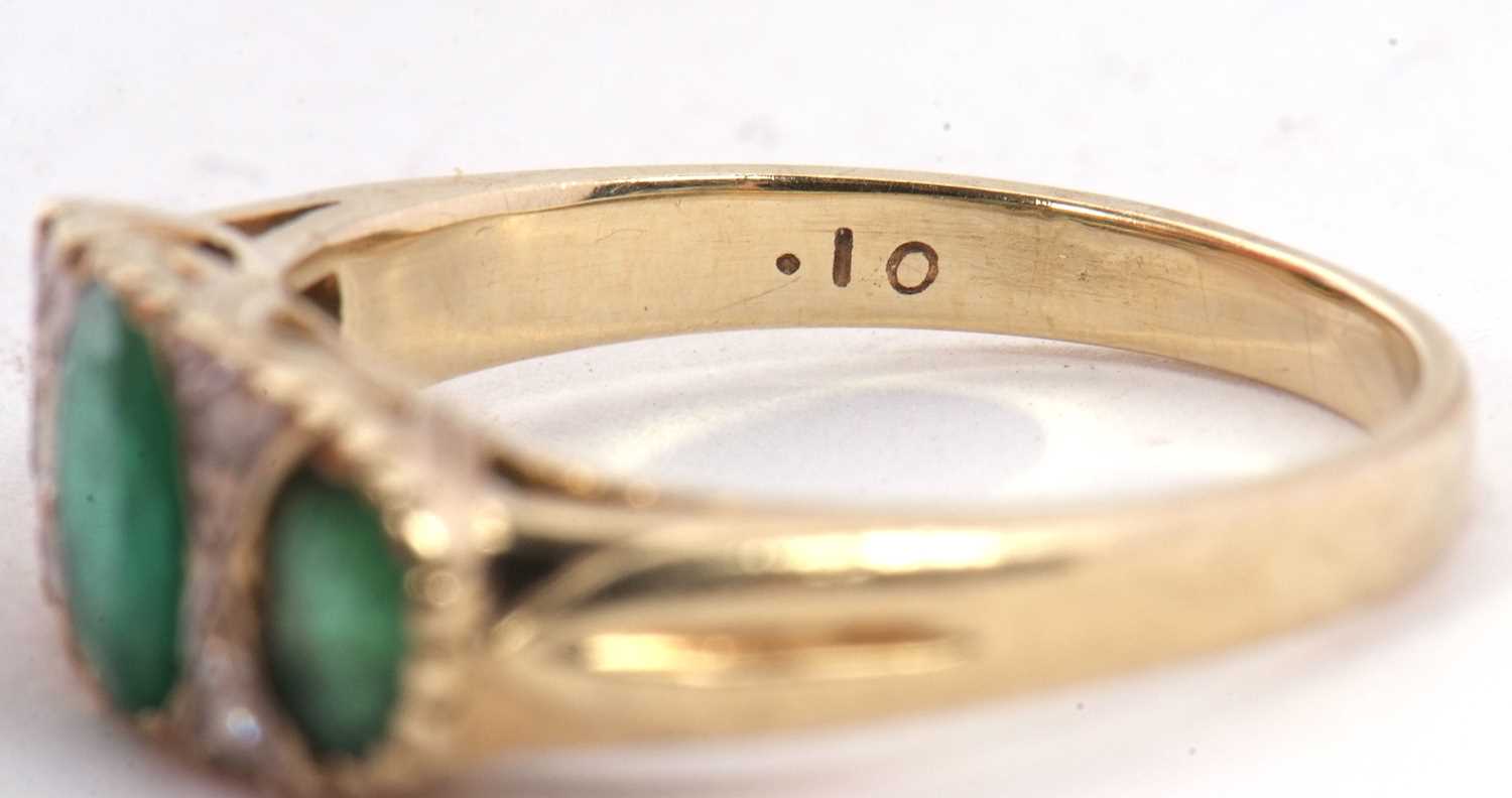 A 9ct emerald and diamond ring, the three graduated oval emeralds, interspaced with two small - Image 5 of 7