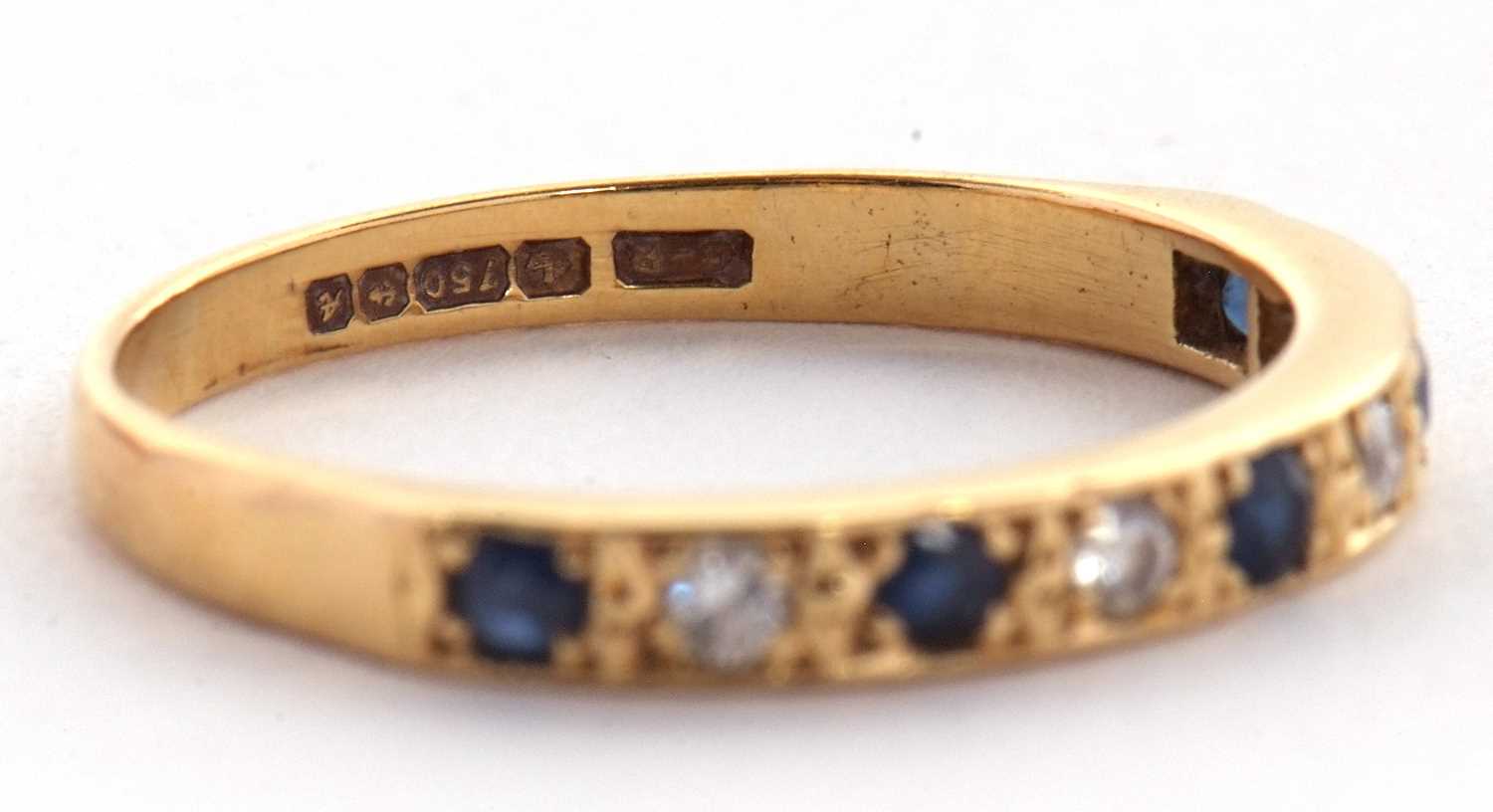An 18ct sapphire and diamond ring, the half hoop ring set with alternating round sapphires and - Image 4 of 5