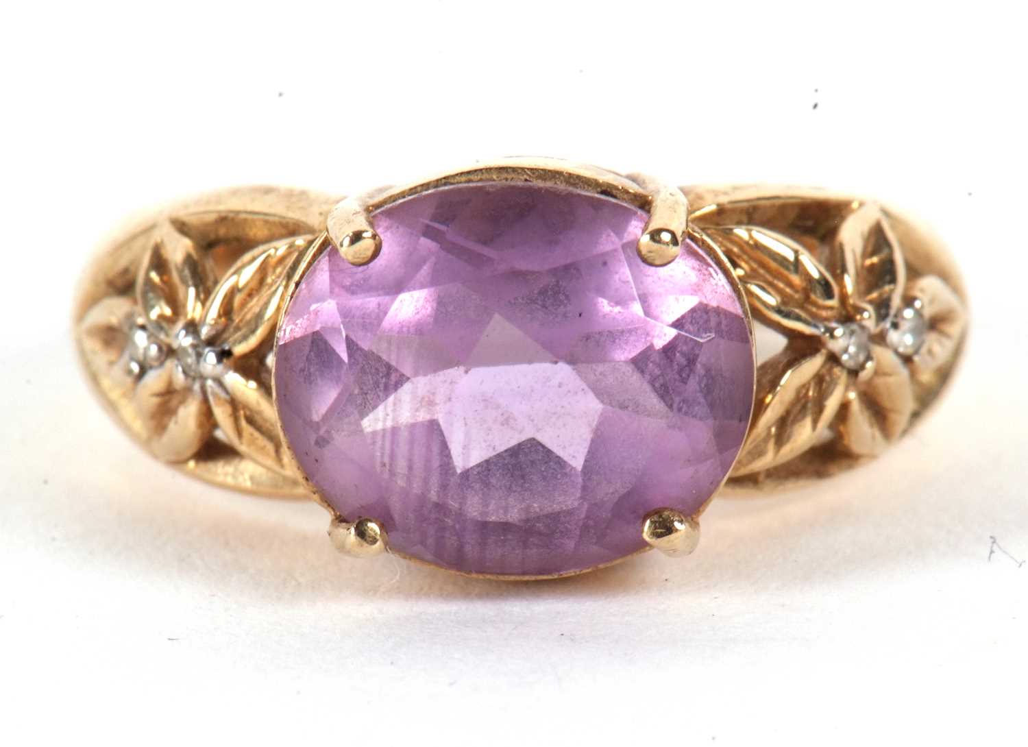 A 9ct amethyst ring, the oval amethyst in a four claw mount, with tapered pierced shoulders set with - Image 7 of 7