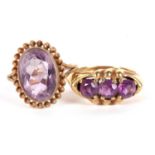 Two amethyst rings, the first an oval collet mounted amethyst with rope twist border, split