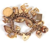 A 9ct charm bracelet, the curblink bracelet with alternate links stamped 9.375, with heart shape