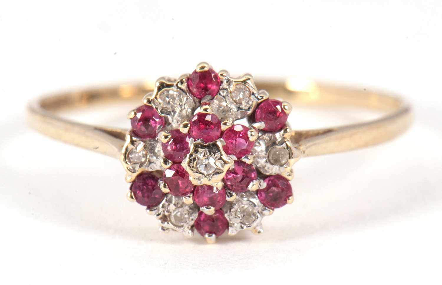 A 9ct pink stone and diamond cluster ring, the small round pink stones and small round diamonds in a