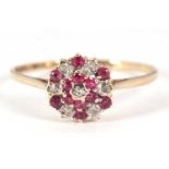A 9ct pink stone and diamond cluster ring, the small round pink stones and small round diamonds in a