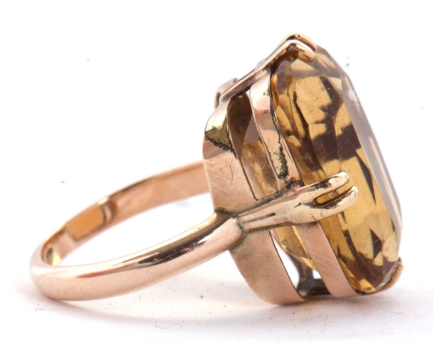 A 9ct citrine ring, the oval mixed cut citrine, approx. 19mm long, in four double claw mount with - Image 3 of 6