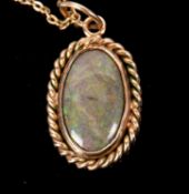 A boulder opal necklace, the oval boulder opal cabochon in a rubover mount with rope twist border of