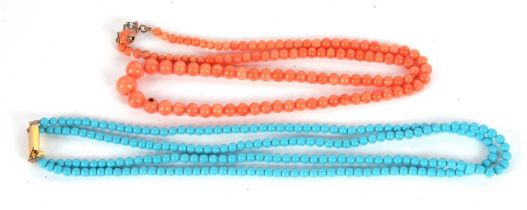 A coral bead necklace, with graduated round beads between 4 - 9mm diameter, with a paste set clasp