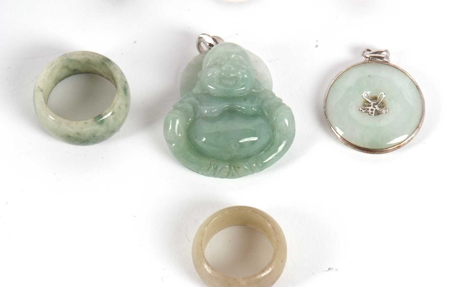 A mixed lot of jewellery to include a jade buddha pendant, 4cm long, two silver rings by Riflessi, - Image 3 of 4
