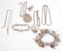 A quantity of silver and white metal jewellery to include a charm bracelet, oval pendant and