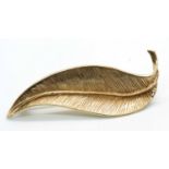 A 9ct leaf brooch, the curved pointed leaf with textured finish, hallmarked to reverse Birmingham