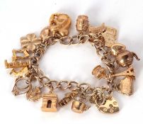 A 9ct charm bracelet, the curblink bracelet hallmarked Birmingham 1974, stamped 375 to both ends,
