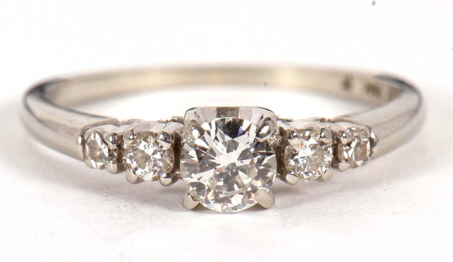 A diamond ring, the central round brilliant cut diamond with a smaller round brilliant and a - Image 3 of 10