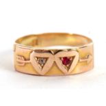 A ruby and diamond double heart ring, the upper half with two hearts and an arrow, one set with a