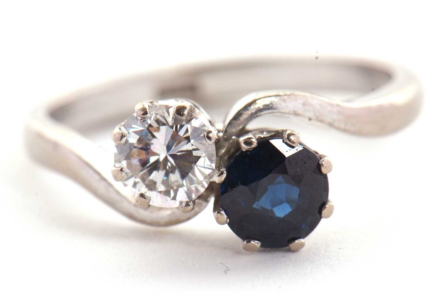 A sapphire and diamond 'toi et moi' ring, the round brilliant cut diamond, estimated approx. 0.