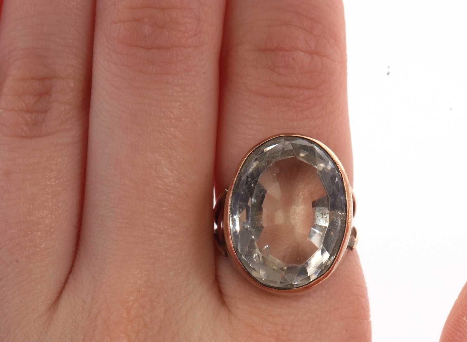 A citrine ring, the oval mixed cut citrine in a deep collet mount, with split shoulders and plain - Image 5 of 5