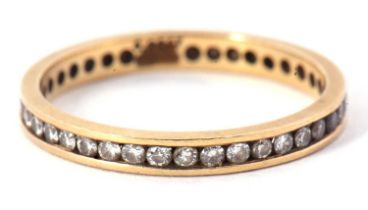 An 18ct eternity ring, with channel set small round diamonds, total estimated approx. 0.50cts,