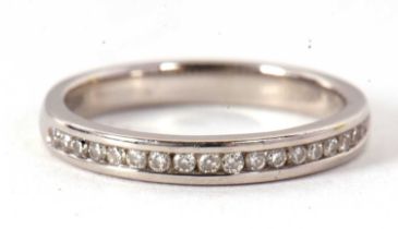 A platinum half eternity ring, with channel set lab grown round brilliant cut diamonds, total 0.