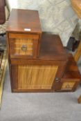 A contemporary Oriental hardwood cabinet of stepped form fitted with two drawers and a central door,