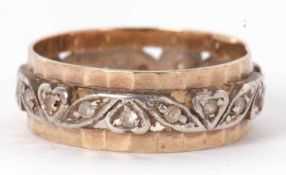 A two tone and white stone eternity ring, the 6.5mm wide yellow metal band with inner white metal