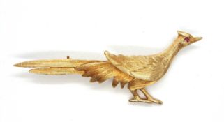 A 9ct pheasant brooch, the naturalistically modelled pheasant with red hardstone eye, hallmarked