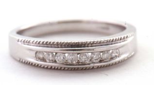 A 9ct white gold and diamond ring, the upper section set with eight small round brilliant cut