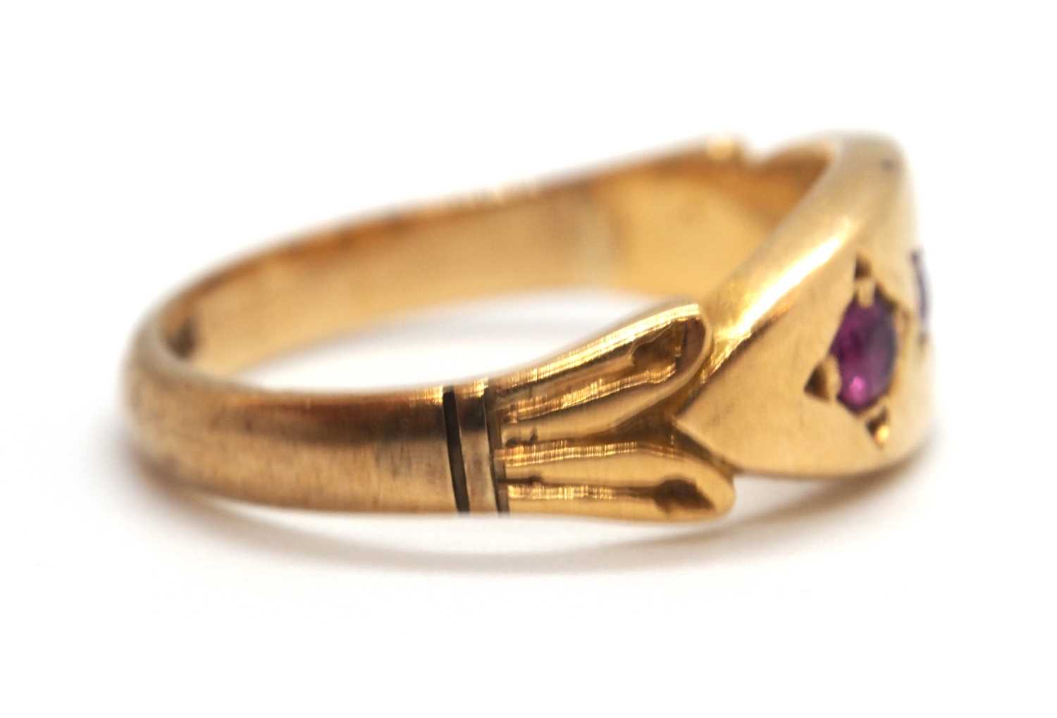 An 9ct ruby ring, the three round gypsy set rubies with plain band stamped 9ct, size I-J, 2.9g - Image 5 of 7