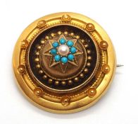 A late Victorian turquoise and pearl brooch, the round Etruscan style brooch set to centre with a