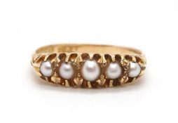 A late Victorian 18ct pearl ring, the five graduated claw mounted pearls with lightly tapered